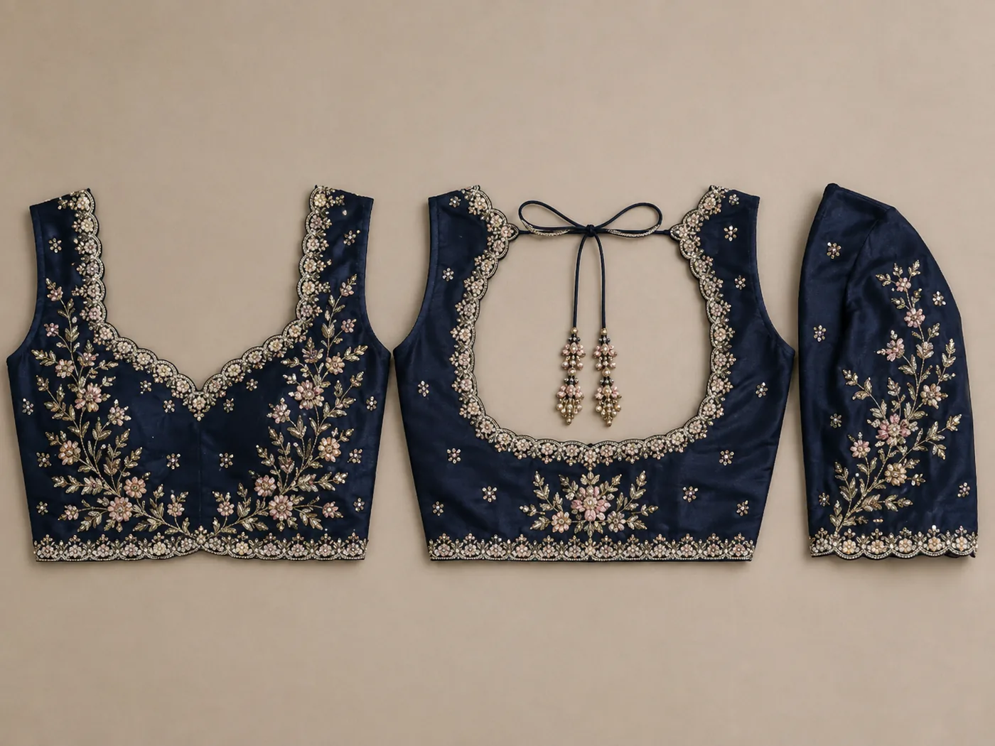 Design reference - Navy blue silk blouse with pale pink and gold flowering sprays climbing the front from the waist, scalloped pearl edging around the sweetheart neck and square back opening, tie strings with bead drops, and a matching floral spray on the sleeve.
